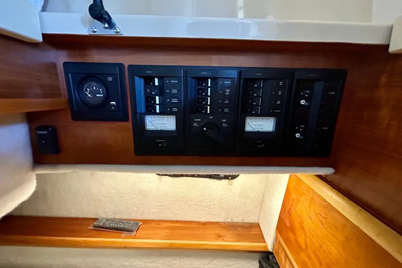 Slide: The Image of Electrical control panel on a 2016 Cutwater C-30 CB boat interior. - 24