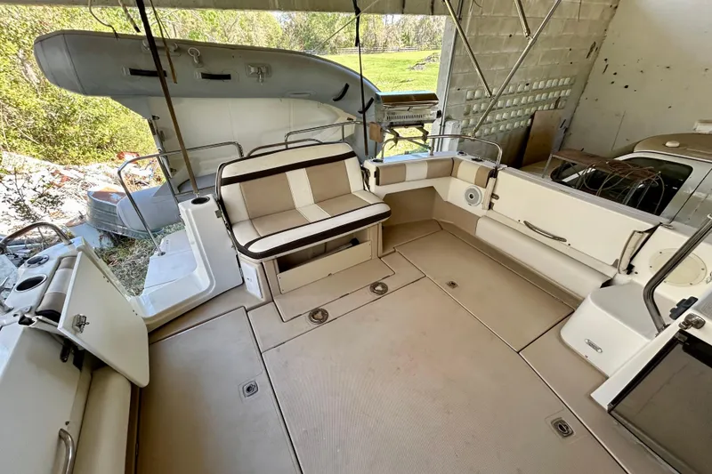 Slide: The Image of 2016 Cutwater C-30 CB boat interior with seating and storage compartments. - 26