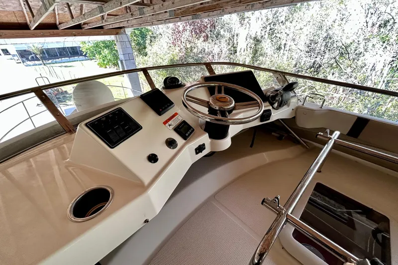 Slide: The Image of 2016 Cutwater C-30 CB boat helm with steering wheel and control panel. - 30