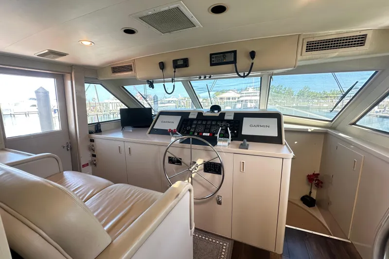 Slide: The Image of Interior helm of 1992 Hatteras 65 Motor Yacht with Garmin navigation system. - 16