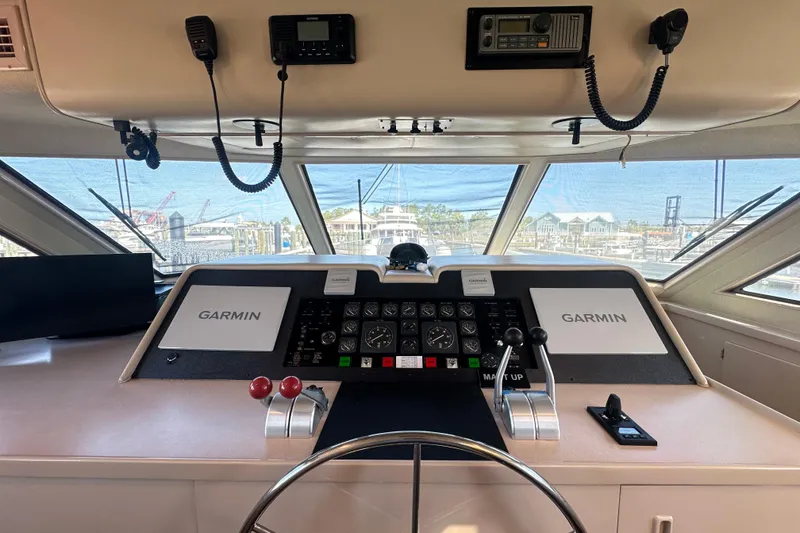 Slide: The Image of Bridge of 1992 Hatteras 65 Motor Yacht with Garmin navigation systems. - 17