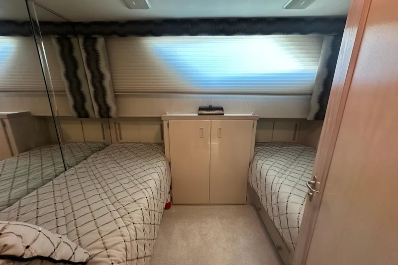 Slide: The Image of Interior cabin of 1992 Hatteras 65 Motor Yacht with twin beds and storage. - 24