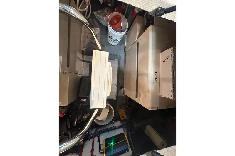 Slide: The Image of Engine room of 1992 Hatteras 65 Motor Yacht with equipment and storage items. - 40