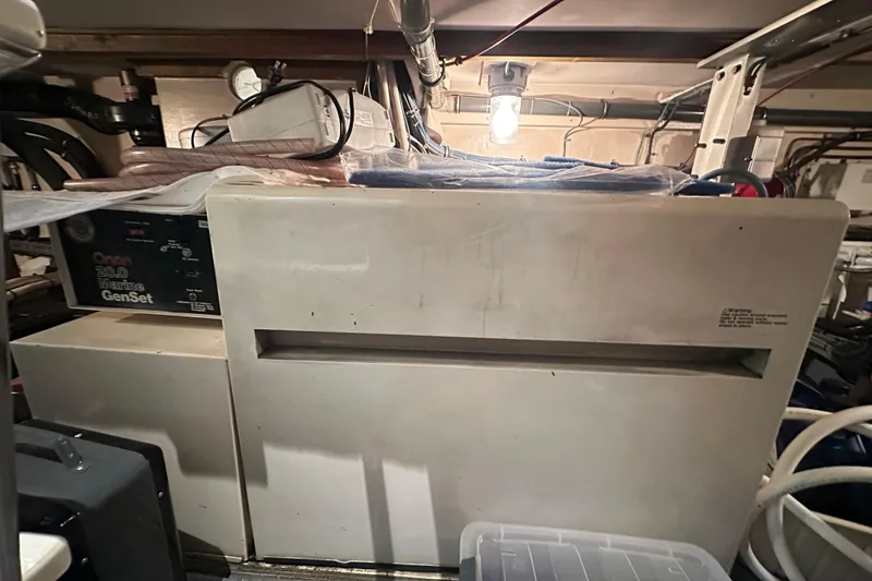 Slide: The Image of Engine room of 1992 Hatteras 65 Motor Yacht with Onan marine generator. - 44