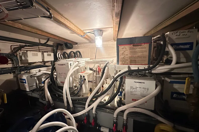 Slide: The Image of Engine room of a 1992 Hatteras 65 Motor Yacht with Dometic equipment and wiring. - 45