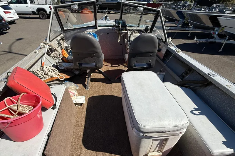 Slide: The Image of 1977 Alumaweld Inboard Jet boat interior with seats, ropes, and equipment. - 10