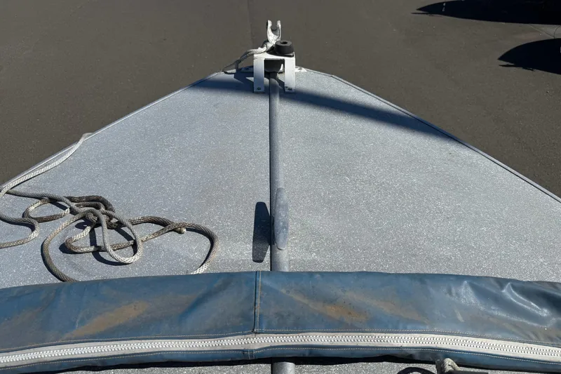 Slide: The Image of 1977 Alumaweld Inboard Jet boat bow with rope and cover. - 15