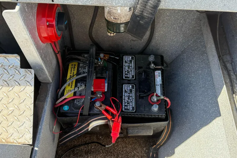 Slide: The Image of Battery compartment of a 1977 Alumaweld Inboard Jet boat with wiring and connections. - 18