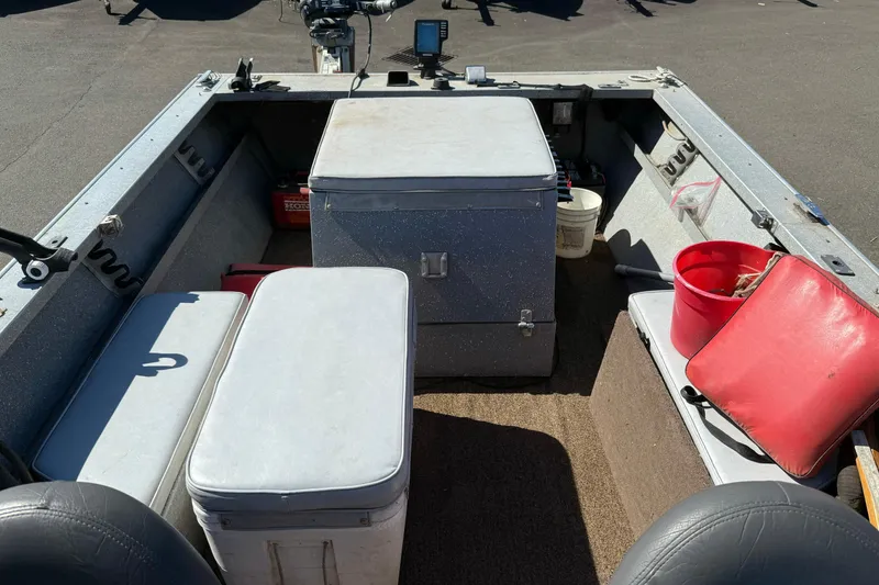 Slide: The Image of 1977 Alumaweld Inboard Jet boat interior with storage compartments and seating. - 9