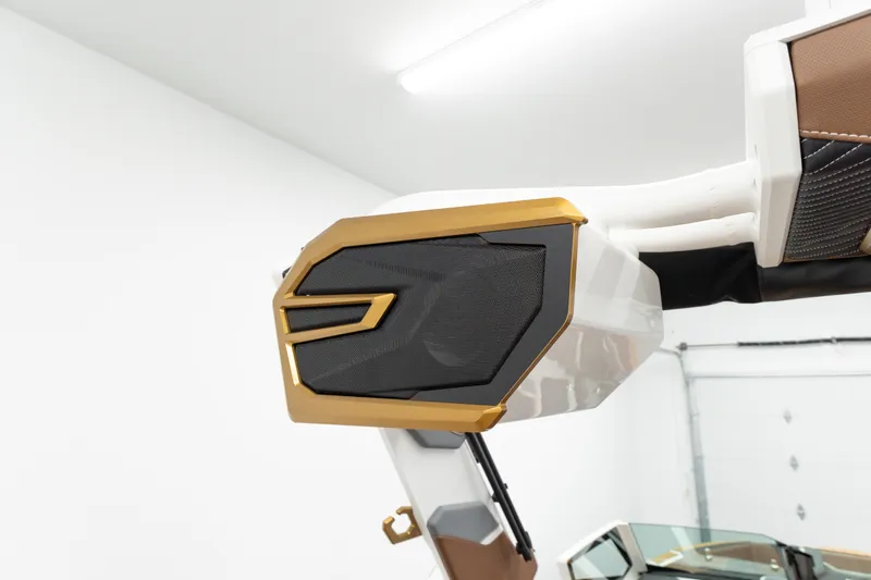 Slide: The Image of 2026 MasterCraft X24 boat speaker with gold accents in a modern interior. - 22