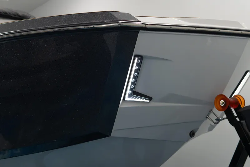 Slide: The Image of 2026 MasterCraft X24 boat detail with sleek design and LED lighting. - 25