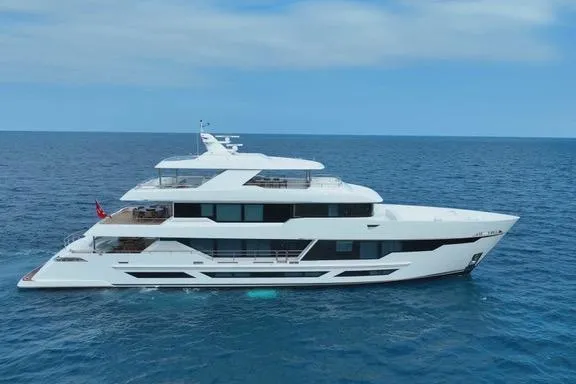 The Image of Luxurious 2025 Hargrave E Series yacht cruising on open sea under clear skies. - 0