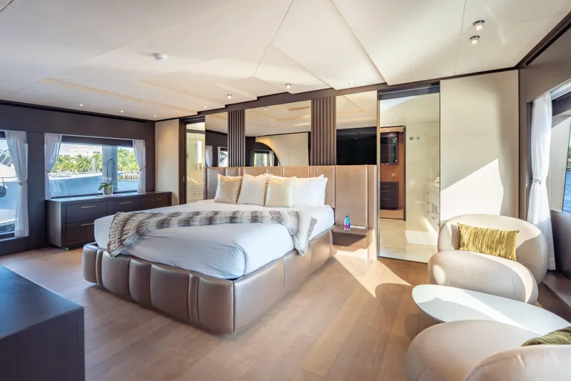 Slide: The Image of Luxurious bedroom interior on 2025 Hargrave E Series yacht, featuring elegant furnishings and ample natural light. - 11