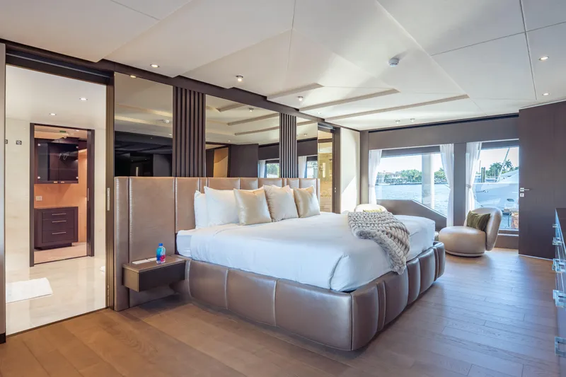 Slide: The Image of Luxurious bedroom interior on 2025 Hargrave E Series yacht with waterfront view. - 13