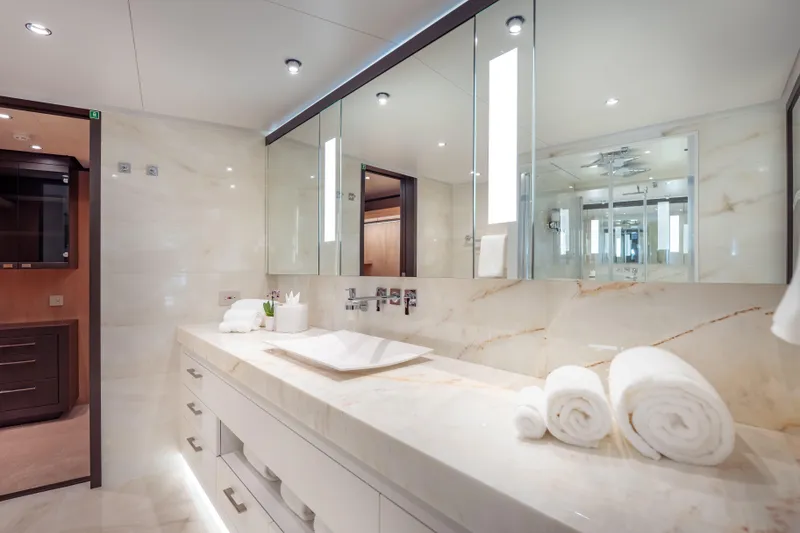 Slide: The Image of Luxurious bathroom in 2025 Hargrave E Series yacht with marble countertops and modern fixtures. - 14