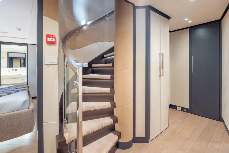 Slide: The Image of Luxurious interior of 2025 Hargrave E Series yacht with elegant spiral staircase. - 19