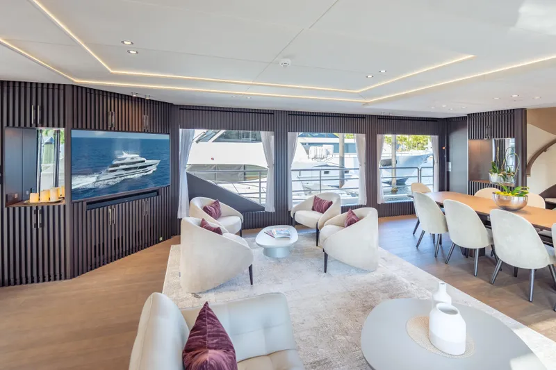 Slide: The Image of Luxurious interior of 2025 Hargrave E Series yacht with modern seating and large windows. - 2