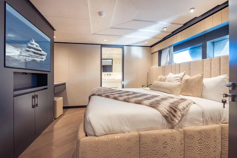 Slide: The Image of Luxurious bedroom interior of 2025 Hargrave E Series yacht with elegant decor and modern amenities. - 20