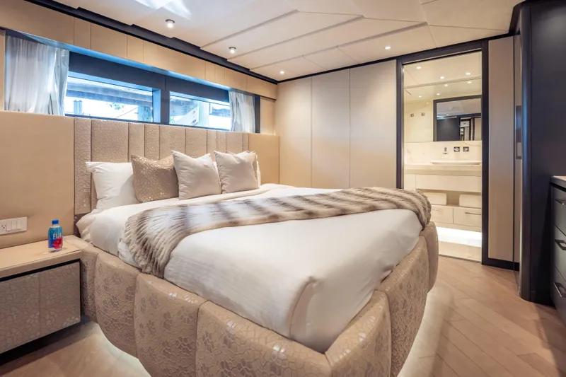 Slide: The Image of Luxurious bedroom interior of 2025 Hargrave E Series yacht with elegant bedding and modern design. - 22