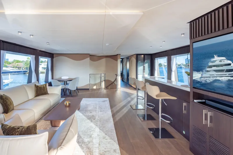 Slide: The Image of Luxurious interior of 2025 Hargrave E Series yacht with modern furnishings and panoramic windows. - 28