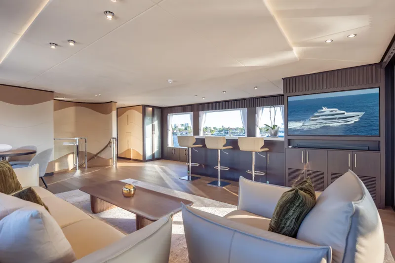 Slide: The Image of Luxurious interior of 2025 Hargrave E Series yacht with modern seating and large windows. - 29