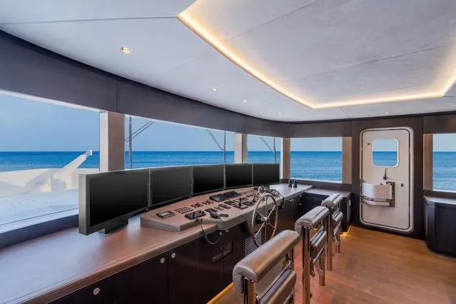 Slide: The Image of Pilothouse of 2025 Hargrave E Series yacht with ocean view and modern controls. - 30