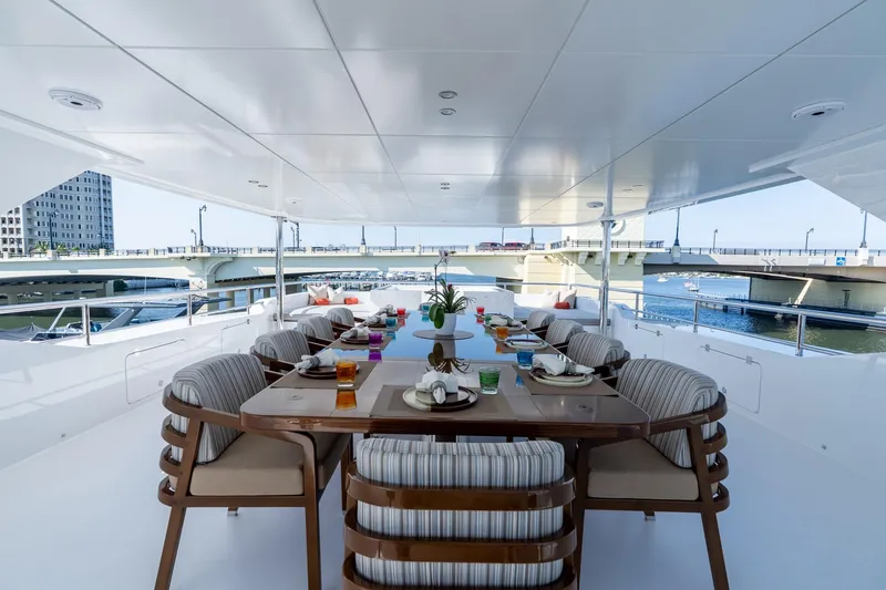 Slide: The Image of Luxurious dining area on 2026 Hargrave E Series yacht, featuring elegant seating and waterfront views. - 39