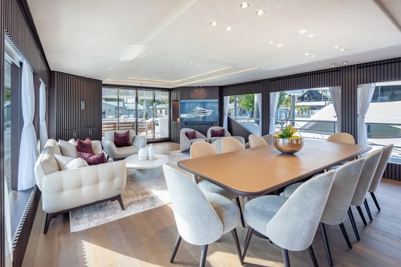 Slide: The Image of Luxurious interior of 2025 Hargrave E Series yacht with elegant dining and seating area. - 5