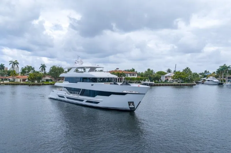 Slide: The Image of Luxurious 2026 Hargrave E Series yacht cruising on a serene waterway. - 52