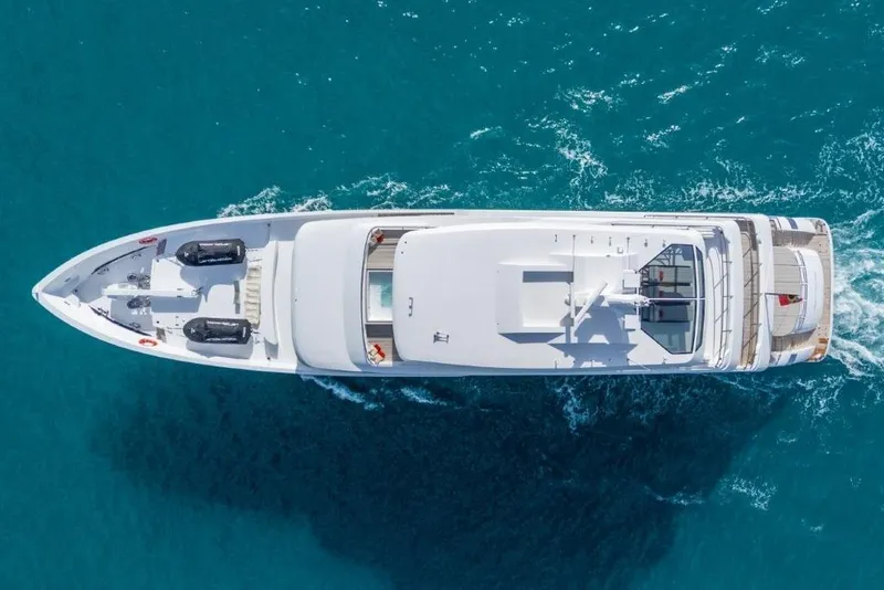 Slide: The Image of Aerial view of 2026 Hargrave E Series yacht cruising in clear blue waters. - 60