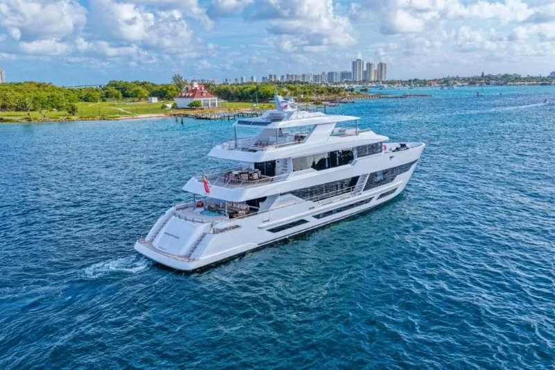 Slide: The Image of Luxurious 2026 Hargrave E Series yacht cruising on a sunny day near the coastline. - 62