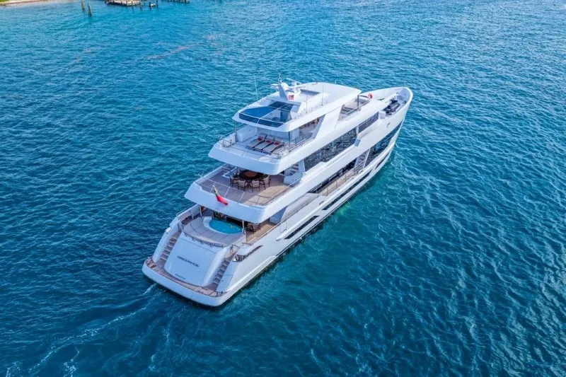 Slide: The Image of Luxurious 2026 Hargrave E Series yacht cruising on clear blue ocean waters. - 63