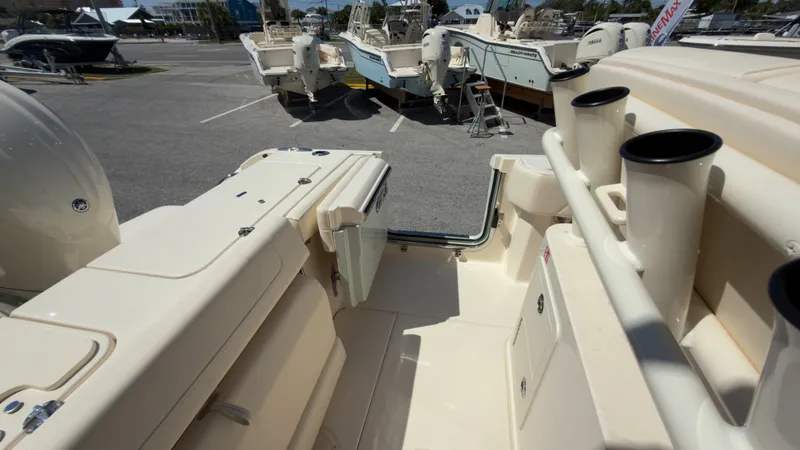 Slide: The Image of The image shows the cockpit of a Grady-White Canyon 266 boat parked in a lot. - 39