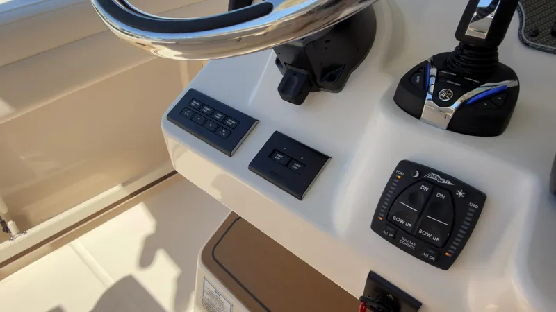 Slide: The Image of Close-up of a Grady-White Canyon 266 helm with modern controls. - 27