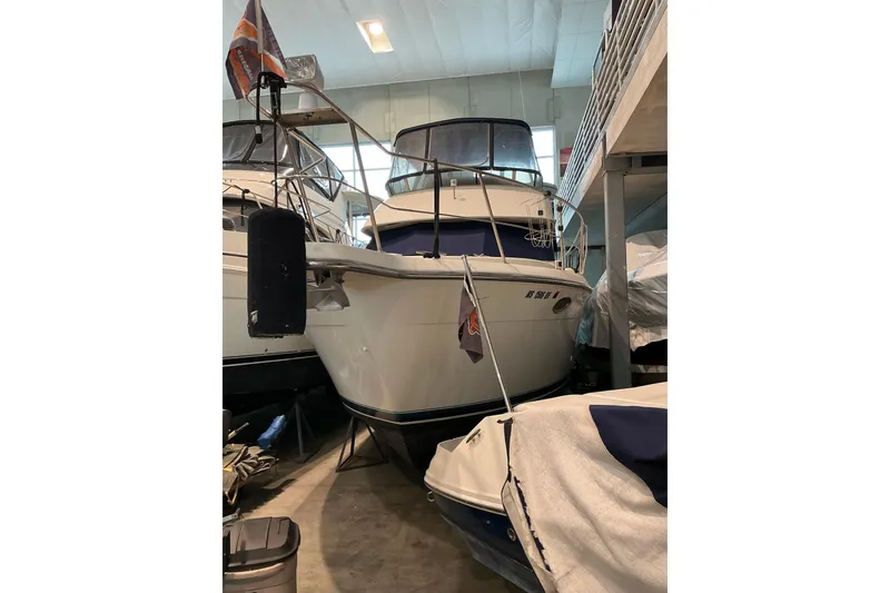 The Image of 1995 Carver 355 Aft Cabin Motor Yacht in indoor storage facility. - 0