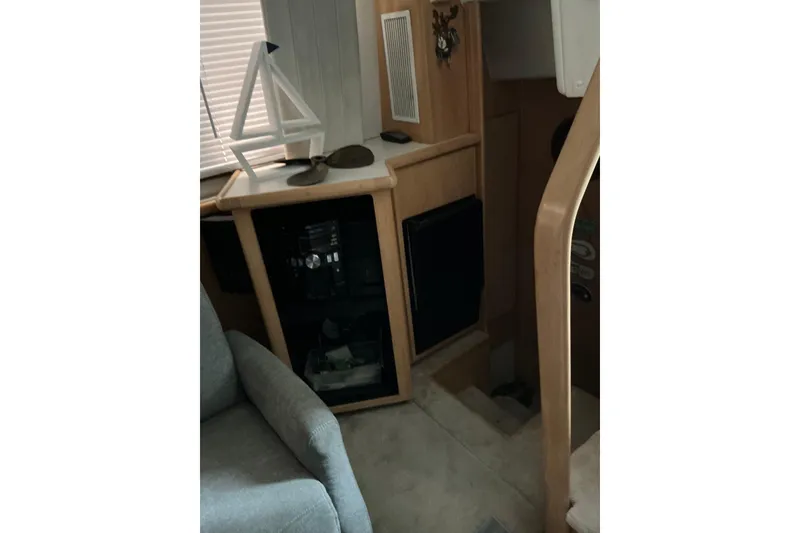 Slide: The Image of Interior of 1995 Carver 355 Aft Cabin Motor Yacht with modern decor and seating. - 10