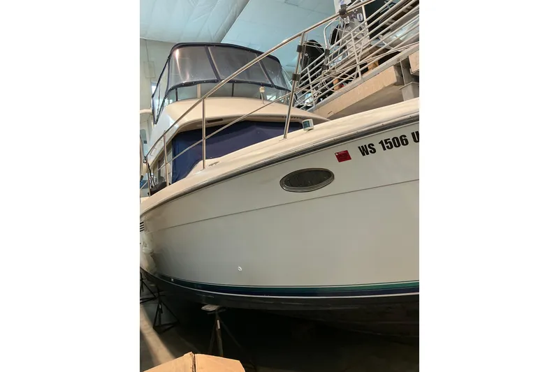 Slide: The Image of 1995 Carver 355 Aft Cabin Motor Yacht in storage, side view. - 13