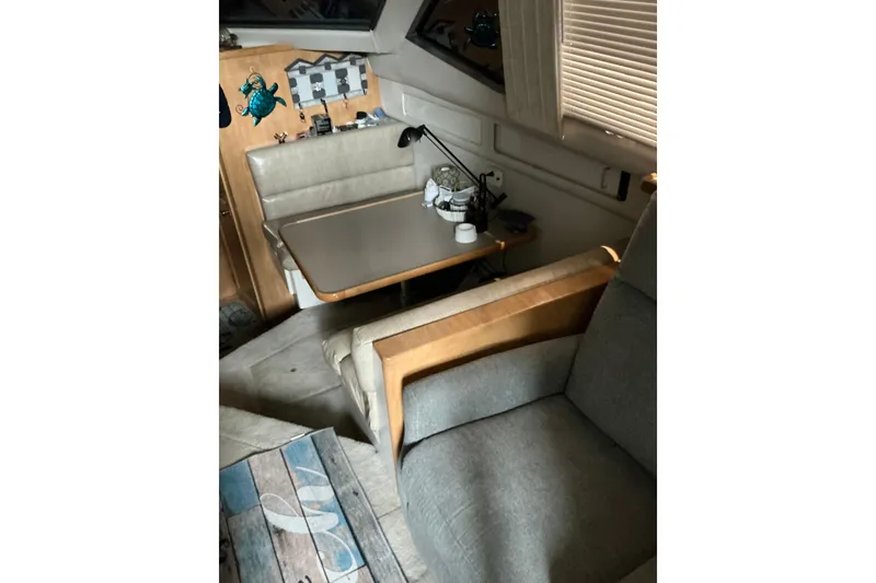 Slide: The Image of Interior of 1995 Carver 355 Aft Cabin Motor Yacht with seating and table. - 16