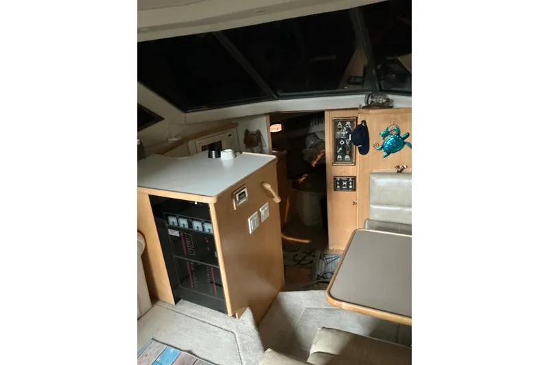 Slide: The Image of Interior of 1995 Carver 355 Aft Cabin Motor Yacht with control panels and seating area. - 17