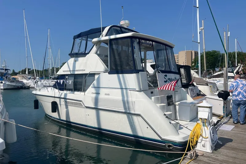 Slide: The Image of 1995 Carver 355 Aft Cabin Motor Yacht docked at marina, sunny day. - 22