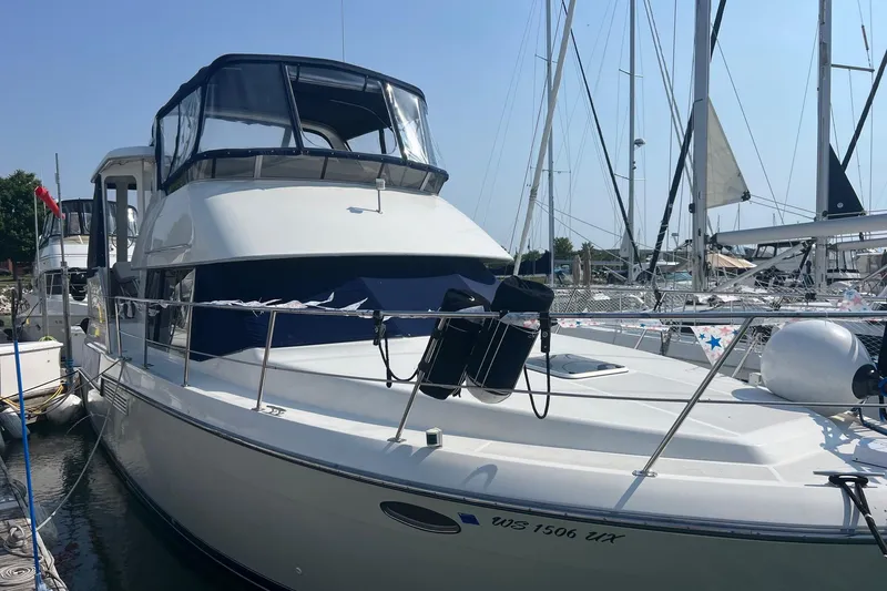 Slide: The Image of 1995 Carver 355 Aft Cabin Motor Yacht docked at marina. - 23