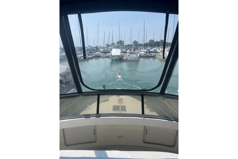 Slide: The Image of View from 1995 Carver 355 Aft Cabin Motor Yacht in marina, showcasing docked boats. - 28