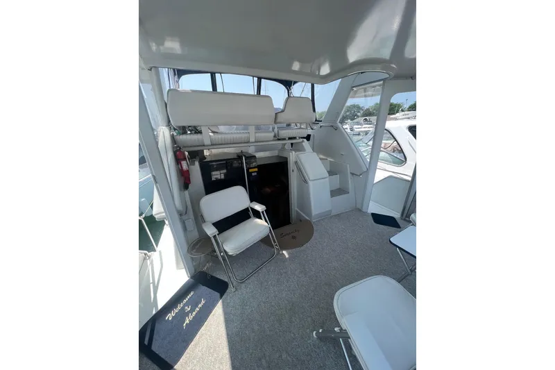 Slide: The Image of Interior of 1995 Carver 355 Aft Cabin Motor Yacht with seating and stairs. - 38