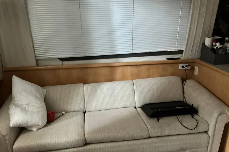 Slide: The Image of Interior of 1995 Carver 355 Aft Cabin Motor Yacht with sofa and blinds. - 7