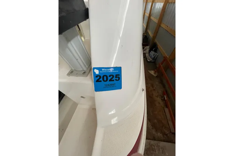 Slide: The Image of 2013 Regal 35 Sport Coupe with Wisconsin registration sticker expiring in 2025. - 11