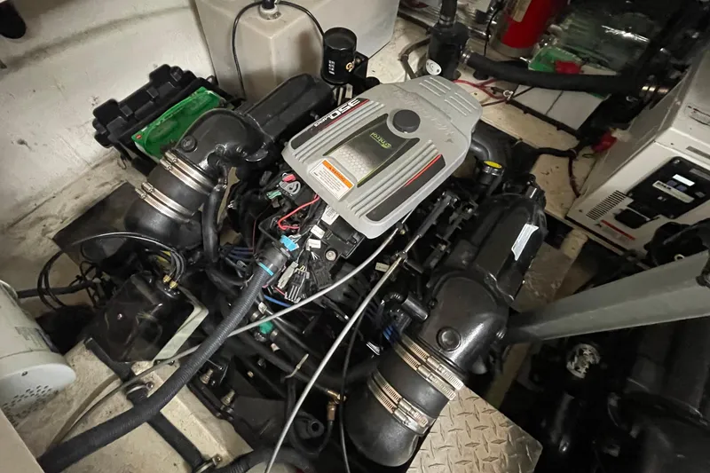 Slide: The Image of Engine compartment of a 2013 Regal 35 Sport Coupe, showcasing detailed mechanical components. - 12