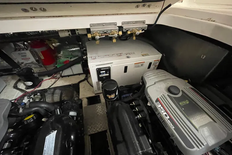 Slide: The Image of Engine room of a 2013 Regal 35 Sport Coupe with visible machinery and components. - 14