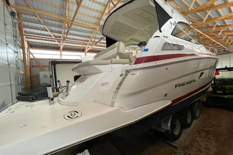 Slide: The Image of 2013 Regal 35 Sport Coupe boat in a wooden storage facility. - 22