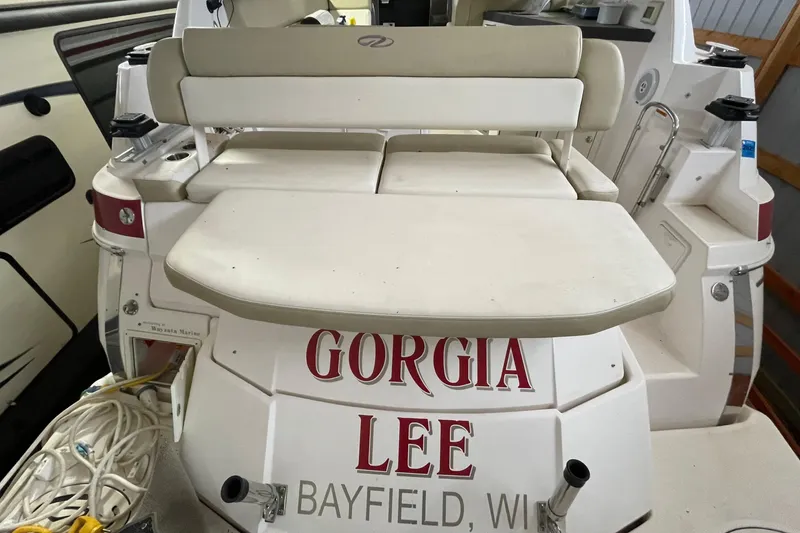Slide: The Image of 2013 Regal 35 Sport Coupe boat with seating, named "Gorgia Lee," docked in Bayfield, WI. - 28