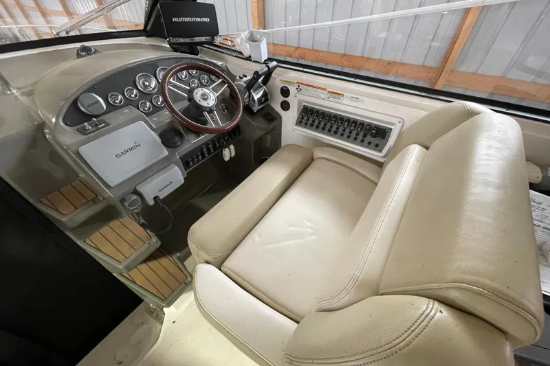 Slide: The Image of 2013 Regal 35 Sport Coupe helm with Garmin and Humminbird electronics, beige seating. - 31
